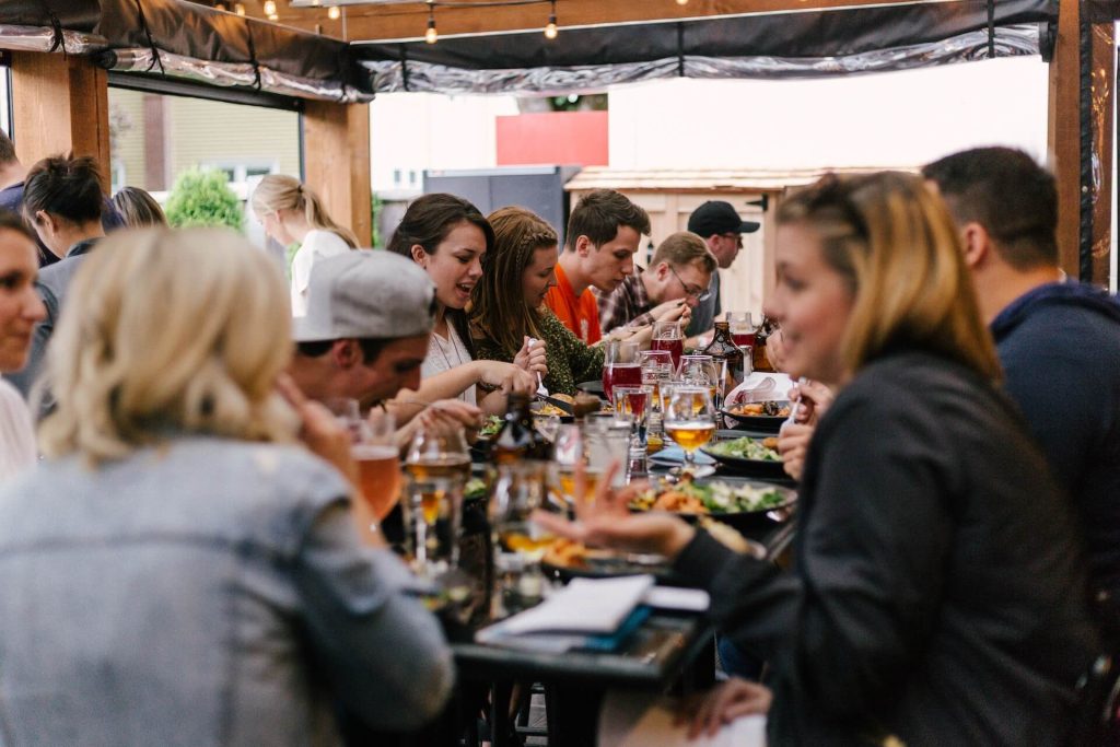 A group of people sitting at a table eating.