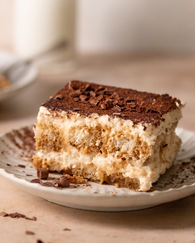 Italian-tiramisu-on-a-plate-with-cocoa-powder-and-chocolate-shavings